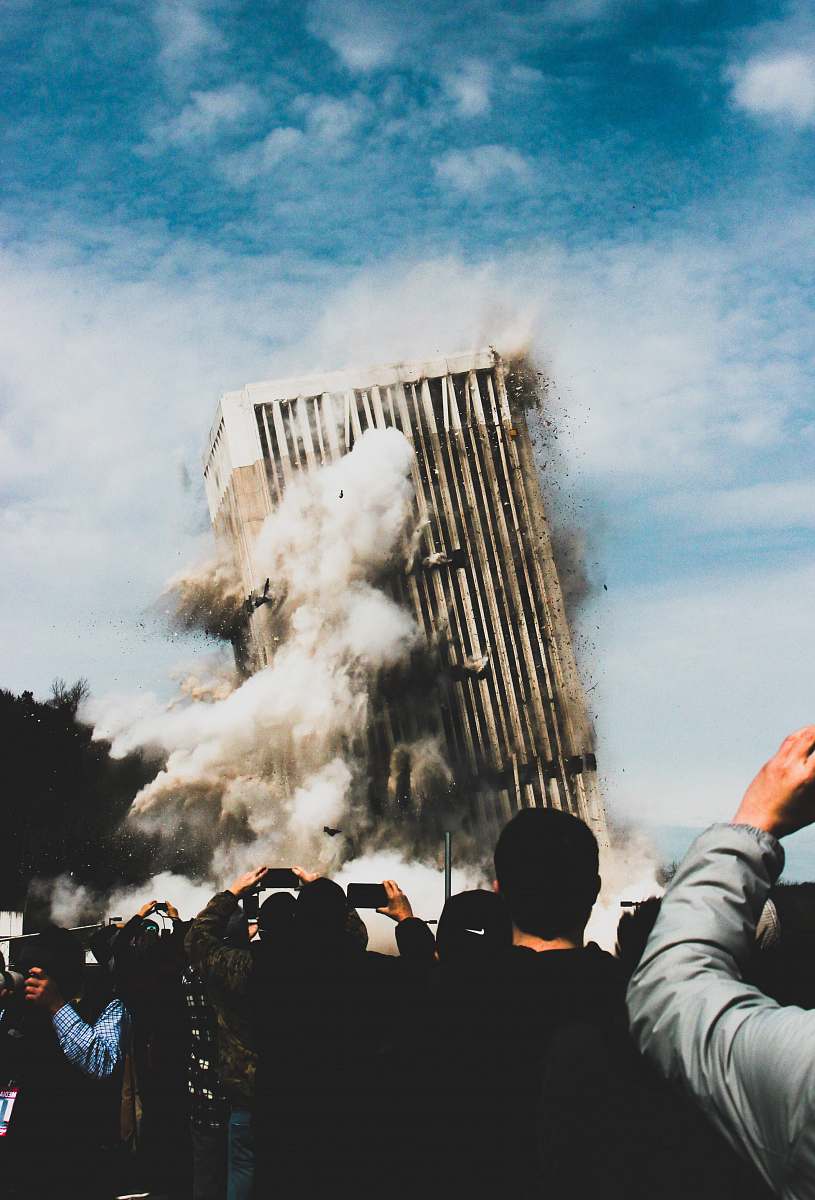 demolition people taking photo of collapsing building frankfort